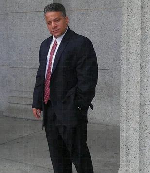 Attorney Yancy L. Garnett standing outside a Massachusetts courthouse
